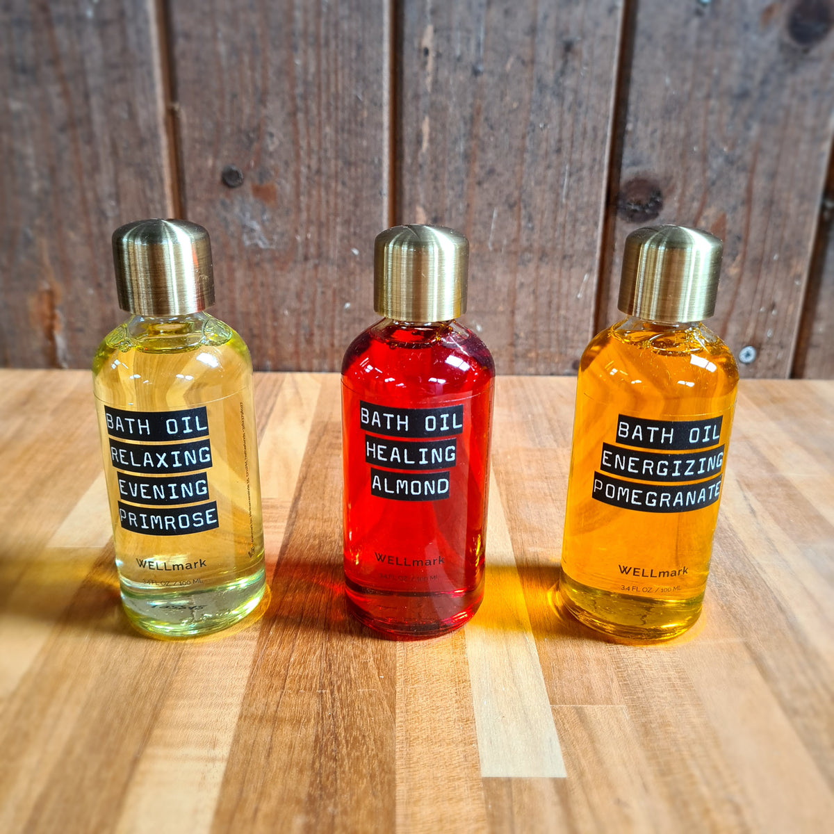 Huile de bain naturelle Wellmark : Flacons à l'onagre, à l'amande et à la grenade.