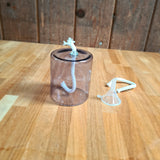 Wellmark Olielamp met glazen reservoir en lont, inclusief trechter.