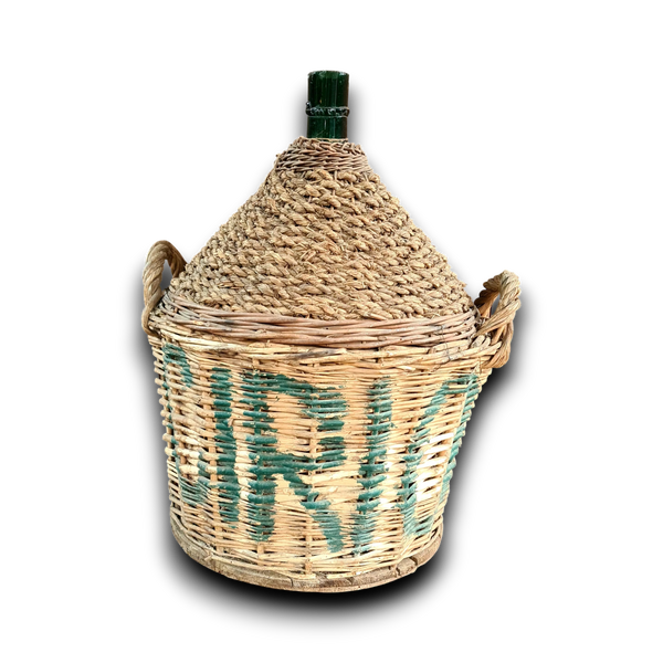 Oude gistfles met bedrukte mand