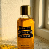 Huile de bain naturelle Wellmark à la formule nourrissante et à la grenade énergisante.